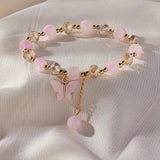 Kaunis rannekoru perhoshelmillä ja joustavalla nauhalla